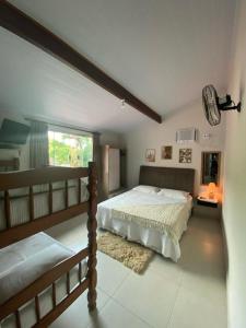 Postel nebo postele na pokoji v ubytování Recanto Guarassol Apartamentos