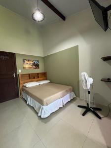 Postel nebo postele na pokoji v ubytování Recanto Guarassol Apartamentos