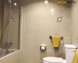 a bathroom with a shower and a toilet and a sink at Blue Sky Montblanc - Swimming Pool & AC in Salou