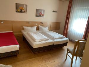 Postel nebo postele na pokoji v ubytování Hotel Sonne - Haus 2