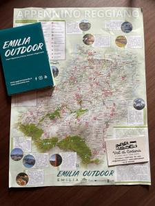 a map of the united states with a book at Val di Codena - Holiday Home in Vetto