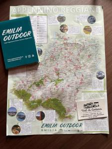a map of the united states with a book at Val di Codena - Holiday Home 