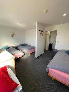 Ένα ή περισσότερα κρεβάτια σε δωμάτιο στο MR TOMO FUJI
