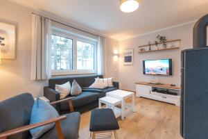 TV a/nebo společenská místnost v ubytování Ferienhaus "Am Kiefernwäldchen"
