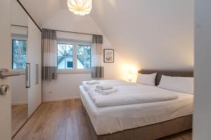 Postel nebo postele na pokoji v ubytování Ferienhaus "Am Kiefernwäldchen"