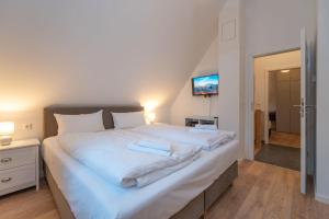Postel nebo postele na pokoji v ubytování Ferienhaus "Am Kiefernwäldchen"