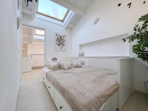 a large white room with a bed in it at Il Nido a Corte di Cadorago in Fino Mornasco