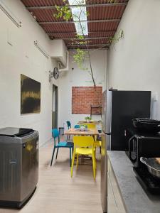 a kitchen with a table and chairs and a dining room at Summer Home 15 Georgetown Adventist in George Town