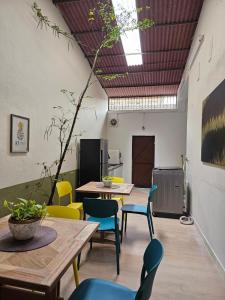 a room with tables and colorful chairs in a room at Summer Home 15 Georgetown Adventist in George Town