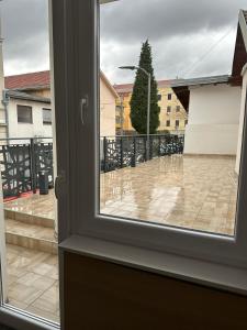 a view of a patio from a window at Apartments and rooms Monaco in Mostar
