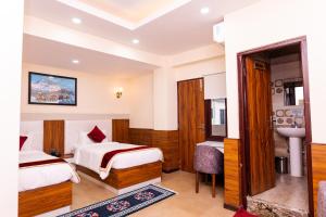 Voodi või voodid majutusasutuse Hotel Palazzo toas