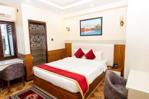 Voodi või voodid majutusasutuse Hotel Palazzo toas