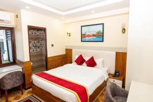 Voodi või voodid majutusasutuse Hotel Palazzo toas