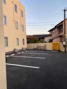 a parking lot in front of a building at MR TOMO FUJI in Fuji