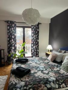 Postel nebo postele na pokoji v ubytování Jordan Apartman
