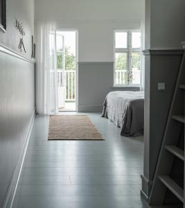 Postel nebo postele na pokoji v ubytování Hotel Ny Hattenæs