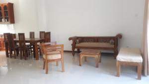 a model of a living room with wooden furniture at Villa 61 - Capital of Sri Lanka in Pagoda +14 photos