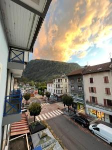 a view from a balcony of a city with a mountain at Chambre centre ville de Cluses in Cluses