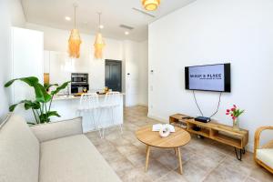 Et tv og/eller underholdning på Hot Breeze Apartment