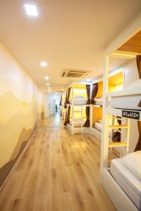 a room with a bunch of bunk beds at Lafami Hostel in Ban Nongdouang