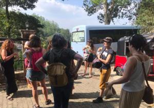 a group of people standing in front of a bus at Funk Bunks - By The Lake in Kandy