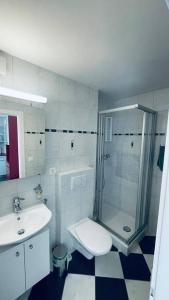 a bathroom with a shower and a toilet and a sink at Escapade montagnarde idéale ! in Vex