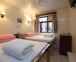 Voodi või voodid majutusasutuse Toronto Guest House toas