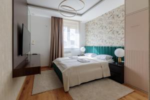 Ένα ή περισσότερα κρεβάτια σε δωμάτιο στο DONNER LUXURY APARTMAN