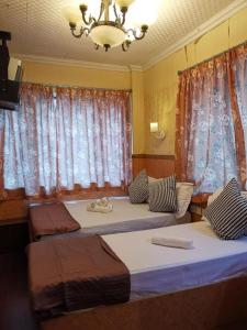 Postel nebo postele na pokoji v ubytování Prime Star Inn