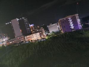 a city skyline at night with tall buildings at Humble homes 1 bedroom Thika Cbd in Thika