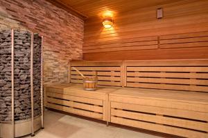 a sauna with a glass of wine in it at Grand Lubicz Uzdrowisko Ustka in Ustka