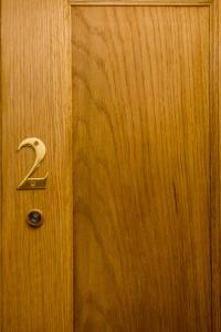 a wooden door with the number two on it at The Rose Bed and Breakfast in Stainland