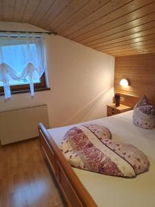 A bed or beds in a room at Ferienwohnung Nancy