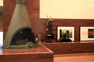 a fireplace sitting on top of a wooden shelf at Hanso Presidential Suite Hanok Hotel in Seoul