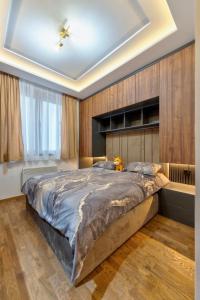 Postel nebo postele na pokoji v ubytování Mans lux 8 Apartman