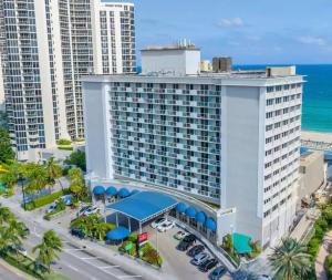 an aerial view of a large building with the ocean at Charming seaside studio for 4 people! - Rate included resort fee-Parking fee not included- in Sunny Isles Beach