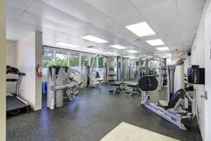 a gym with treadmills and machines in a room at Charming seaside studio for 4 people! - Rate included resort fee-Parking fee not included- in Sunny Isles Beach