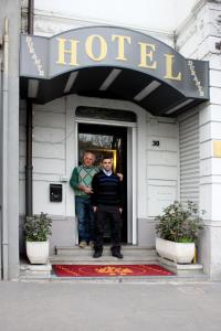 two men standing in the doorway of a hotel at Lux Hotel Durante in Milan