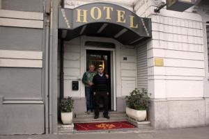 two men standing in the doorway of a hotel at Lux Hotel Durante in Milan