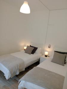 Postel nebo postele na pokoji v ubytování Casa Carlota