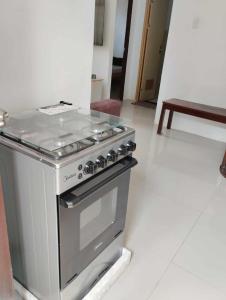 a stainless steel stove in a room at Vin's Place Rentals in Tagum