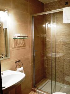 a bathroom with a shower and a sink at Hotel Bonsol in Lloret de Mar