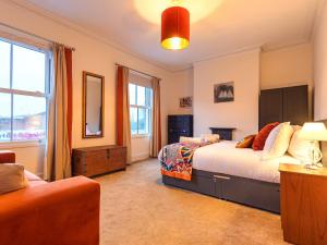 a bedroom with two beds and a window at Charming Victorian Hidden Gem - Pass the Keys in Market Drayton