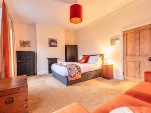a bedroom with two beds and a dresser at Charming Victorian Hidden Gem - Pass the Keys in Market Drayton