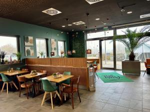 Restoranas ar kita vieta pavalgyti apgyvendinimo įstaigoje AUSZEIT DAS HOTEL Asbach-Bäumenheim