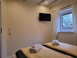Postel nebo postele na pokoji v ubytování Ferienhaus Wind