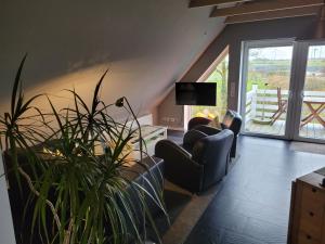 Posezení v ubytování Ferienhaus Wind