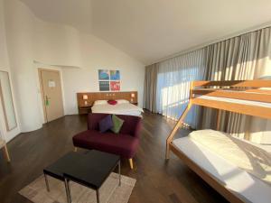 Un pat sau paturi într-o cameră la Businesshotel Lux