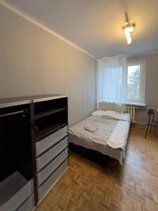Posteľ alebo postele v izbe v ubytovaní Kwadrat B&B Jałowego
