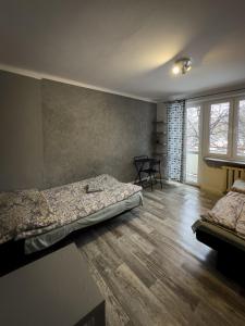 Posteľ alebo postele v izbe v ubytovaní Kwadrat B&B Jałowego